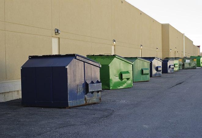 large garbage containers clustered on a construction lot in New Wilmington